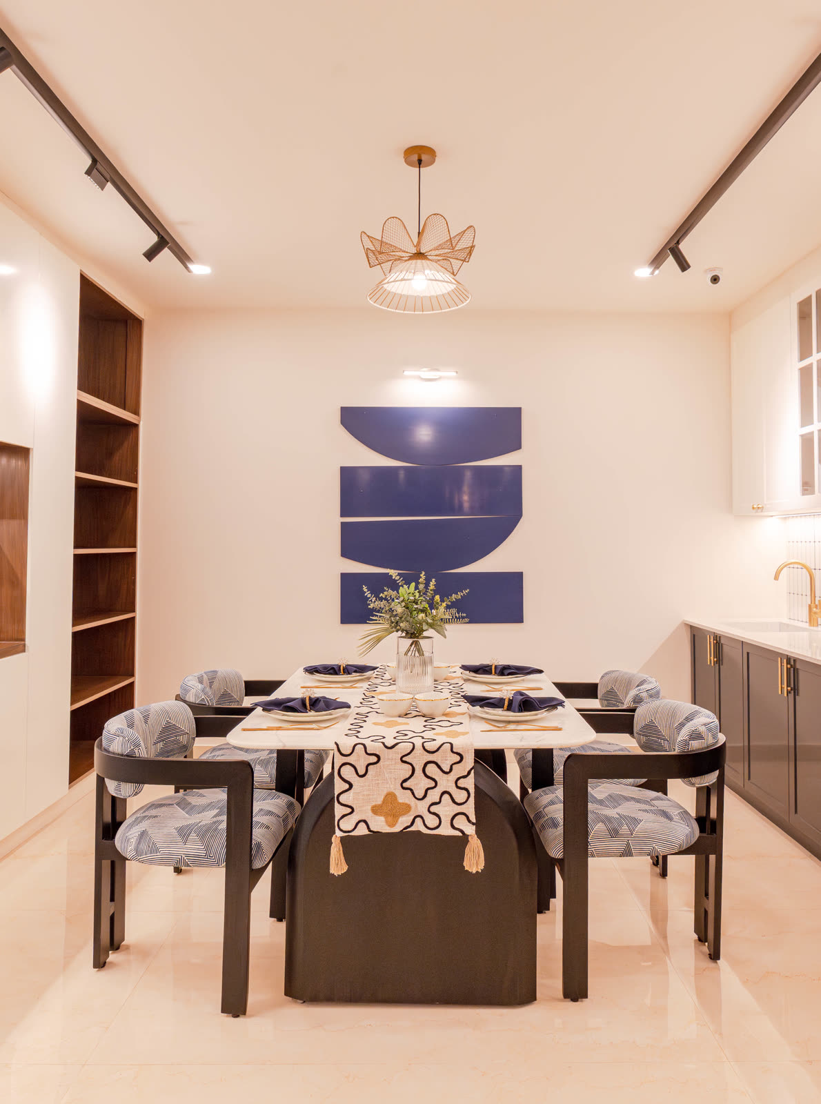 Beige Experience Centre — Dining Setups — Sculptural lighting · sleek table