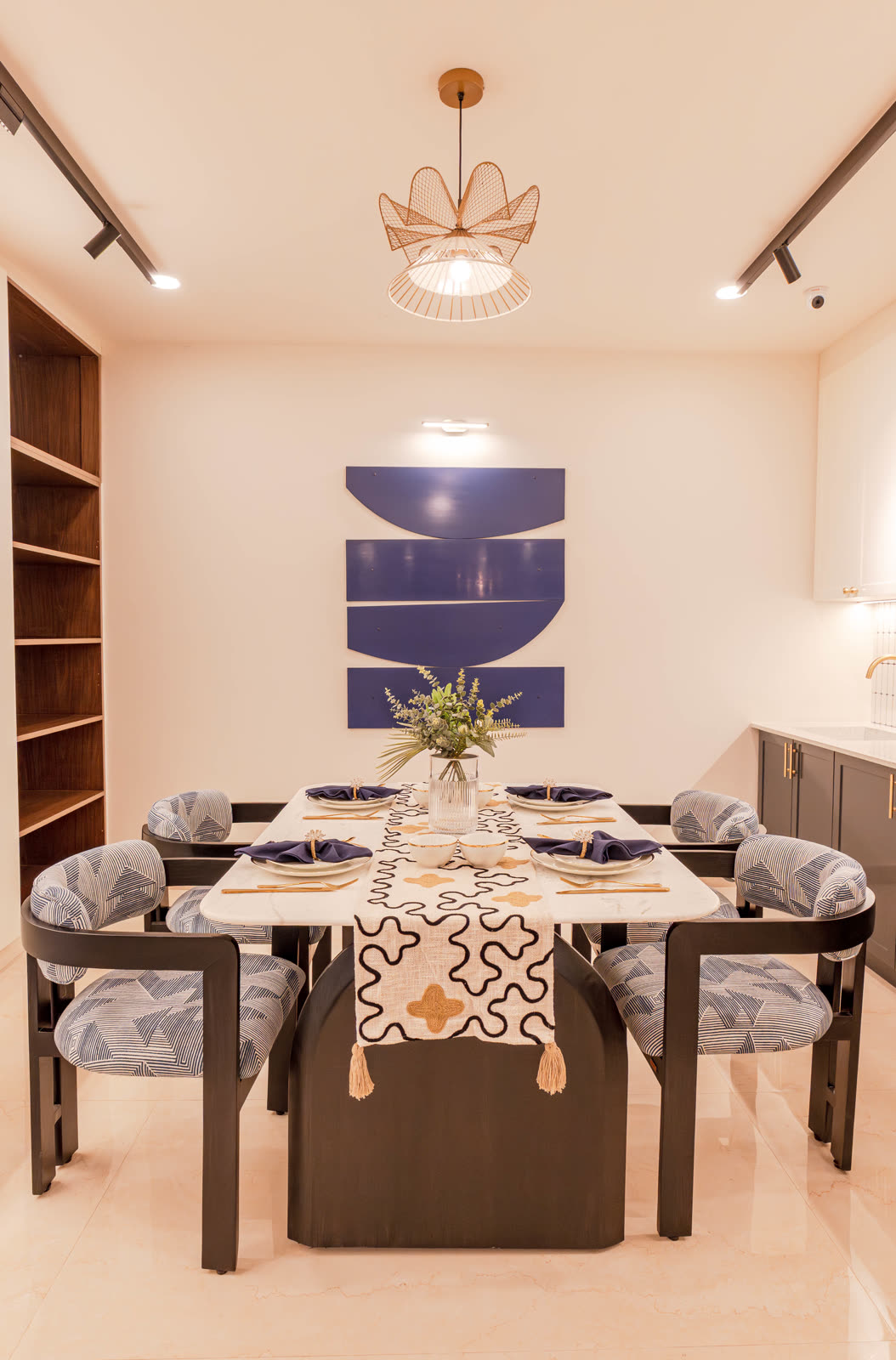 Beige Experience Centre — Dining Setups — Statement chairs · gallery wall