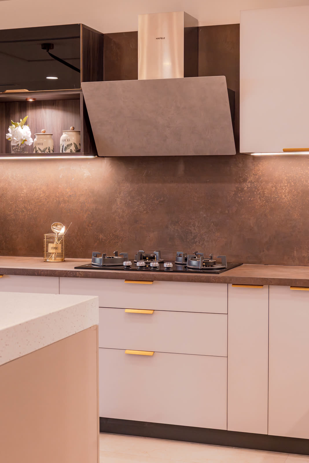 Beige Experience Centre — Modular Kitchen — Wood + laminate · exposed chimney