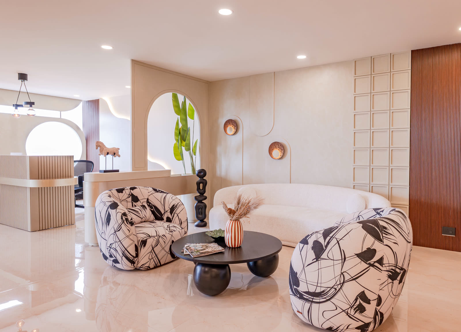 Beige Experience Centre — Sofa & Lounge — Arch backdrop · monochrome lounge