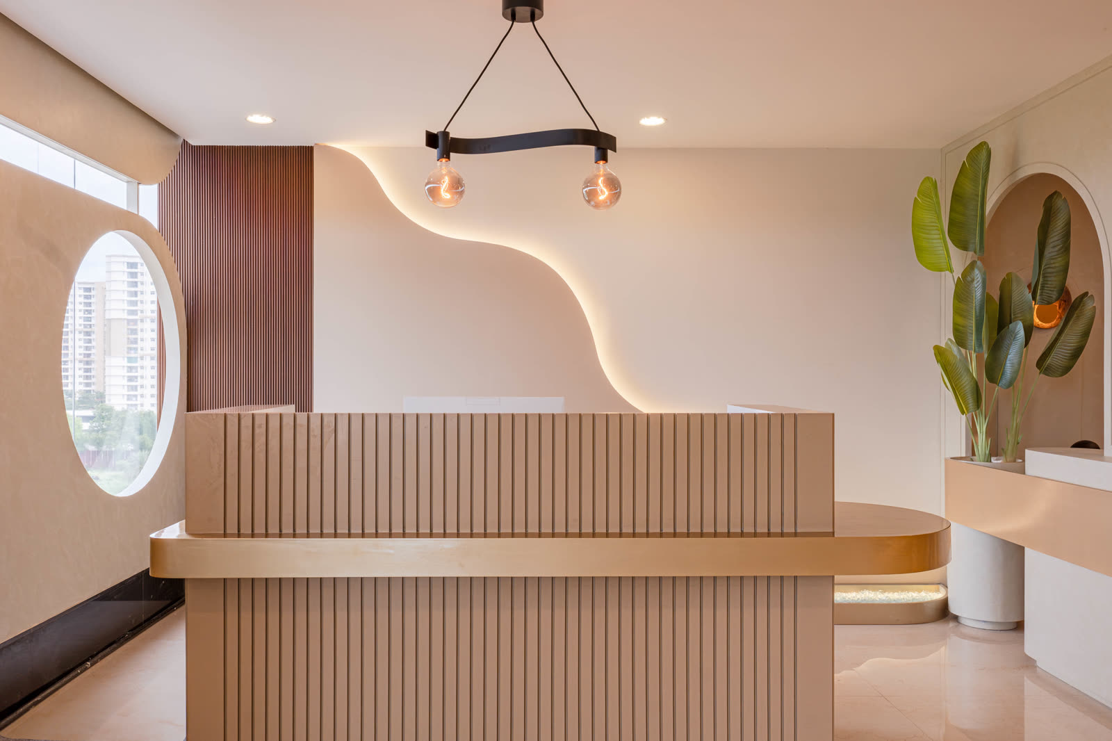 Beige Experience Centre — Foyer & Entry Console — Fluted oak · brass detail