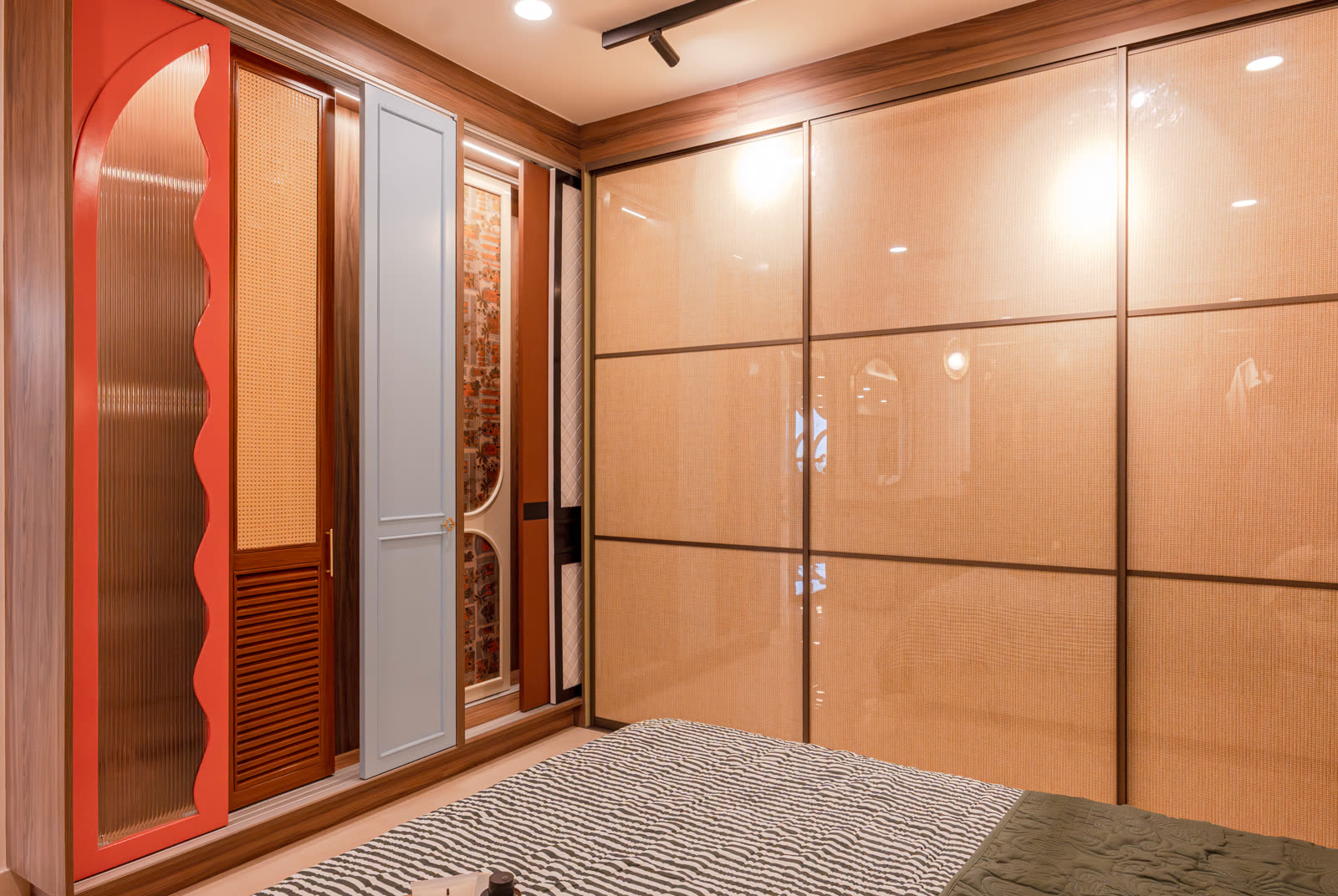 Beige Experience Centre — Wardrobe — Cane shutters · fluted glass arch
