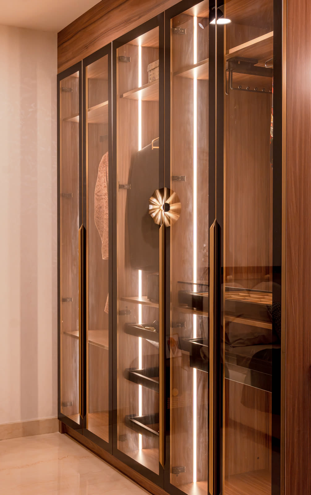 Beige Experience Centre — Wardrobe — Wood grain · lit glass shutters