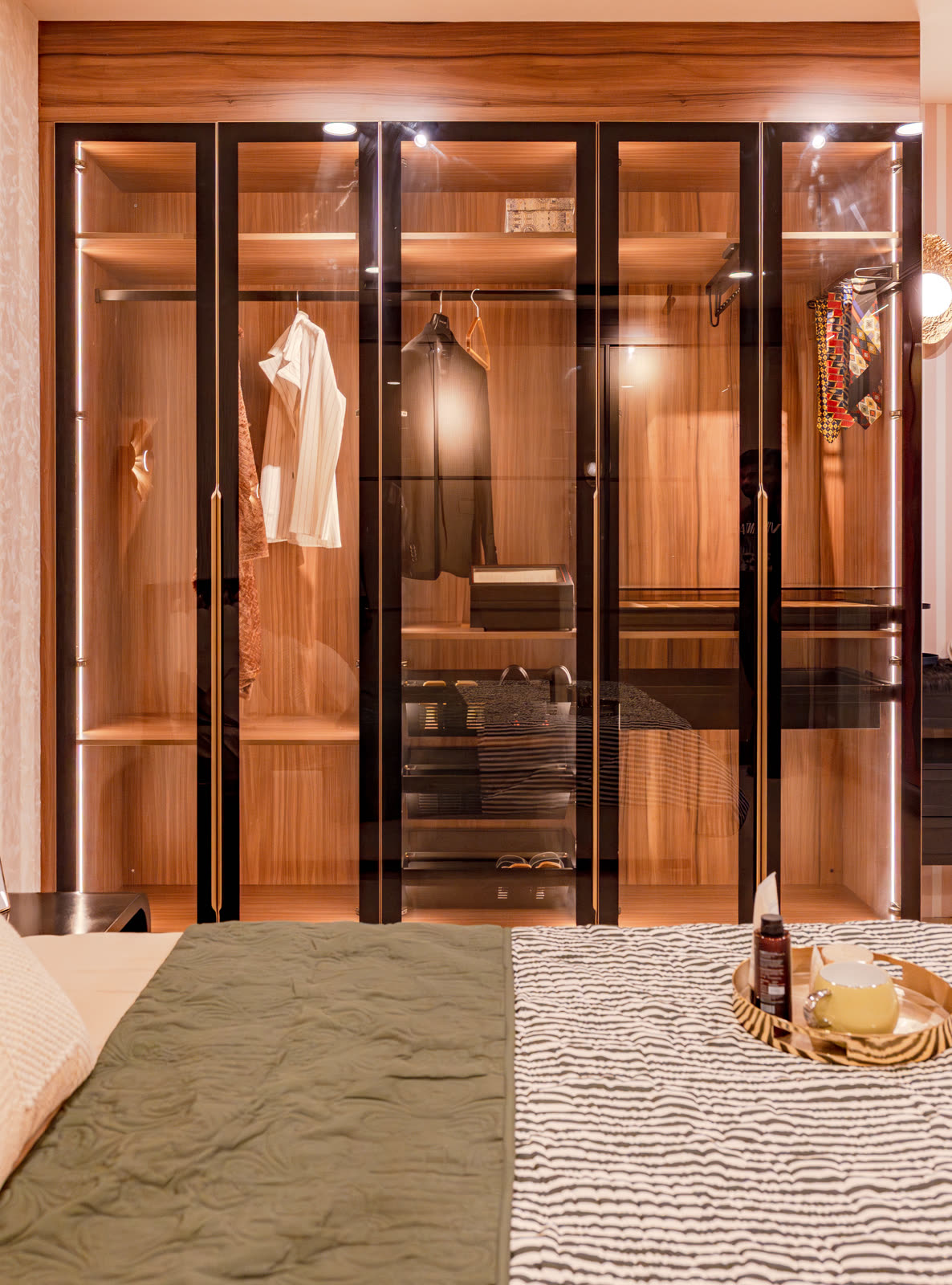 Beige Experience Centre — Wardrobe — Glass front · lit interior