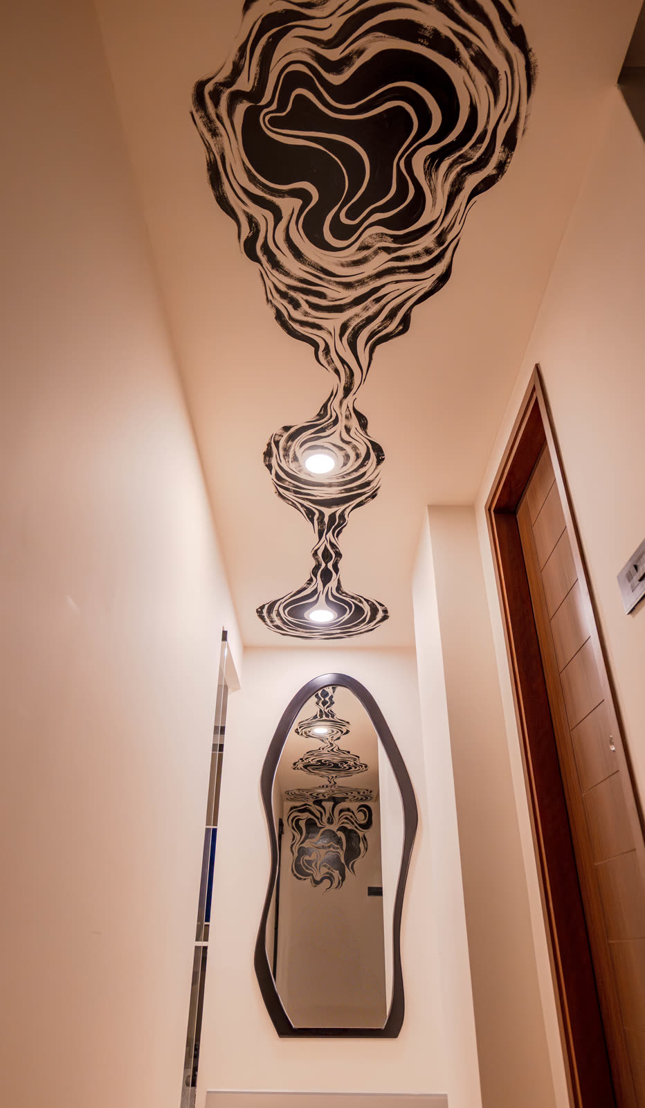 Beige Experience Centre — Foyer & Entry Console — Sculpted mirror · ceiling artwork